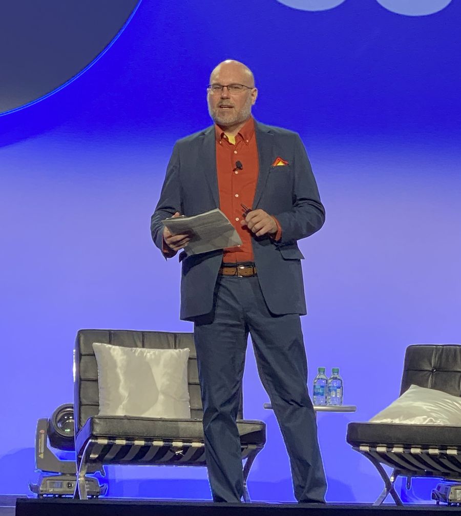 Paul Tonden facilitating a session on stage